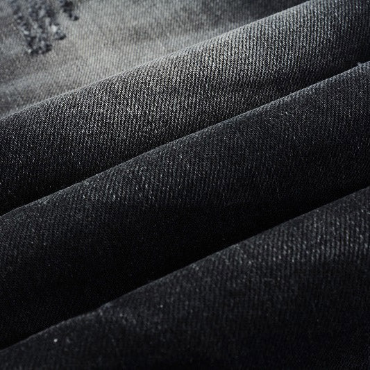 AMIRI Patchwork Slim Jeans – Full Logo Distressed Denim